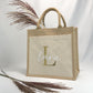 Personalisierte Jutetasche mit Namen, ideal als nachhaltiges Geschenk für Geburtstag oder Weihnachten. Mit praktischer Baumwolltasche für zusätzlichen Stauraum. Perfekt als Handtasche mit Name oder Geschenke für Frauen.