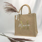 Jutetasche im Einsatz beim Einkaufen oder für den Alltag. Die Tasche ist personalisiert und bietet ausreichend Platz für Ihre täglichen Bedürfnisse. Ideal als Handtasche mit Name oder Geschenke für Frauen.