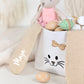 Hasenkorb personalisiert mit Namen des Kindes, ideal als Osterkorb Kinder für die traditionelle Eiersuche. Dieses Ostergeschenk für Kinder kombiniert süßes Design mit praktischer Funktion und ist perfekt zum Befüllen mit Ostereiern und kleinen Überraschungen.
